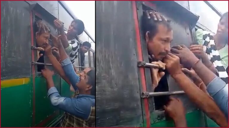 A man's head stuck in the window of an RTC bus